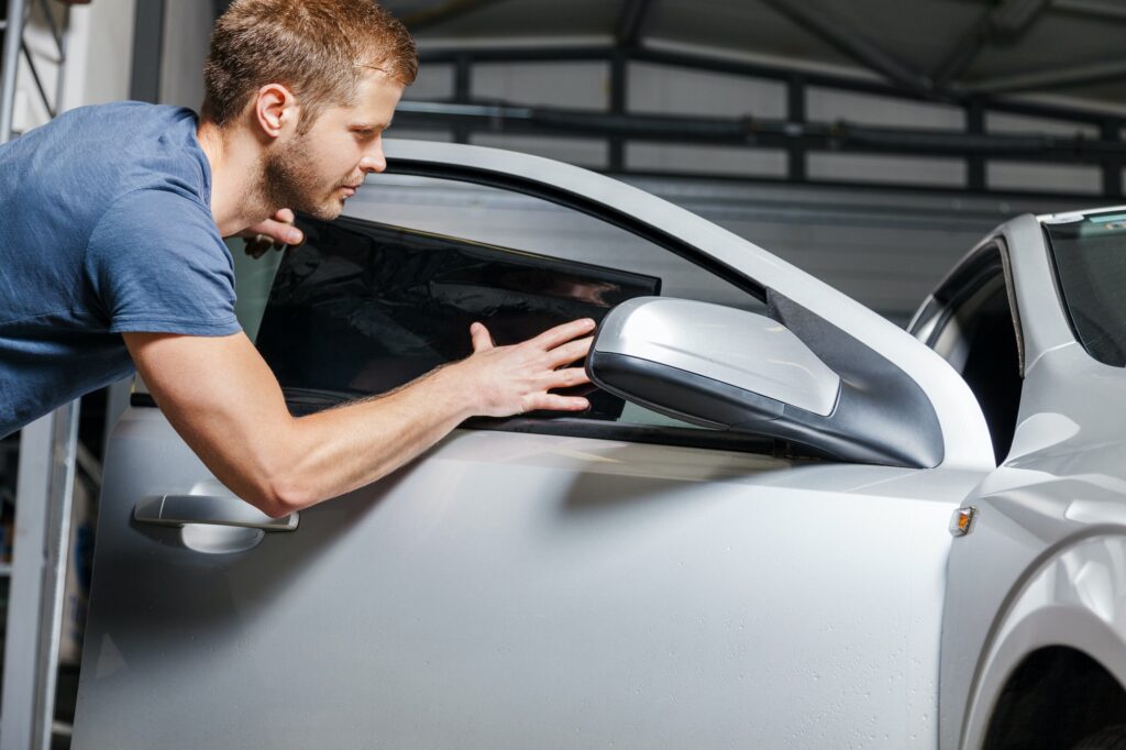 Applying tinting foil onto a car window